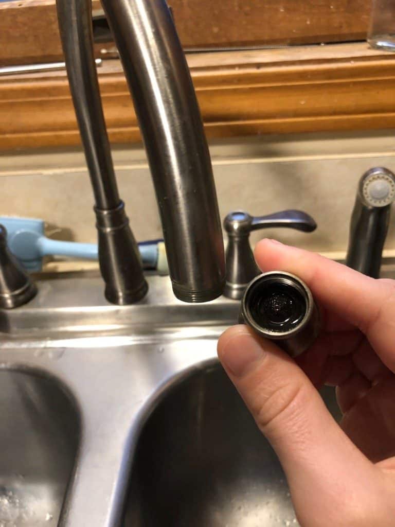 How to clean a dirty faucet head